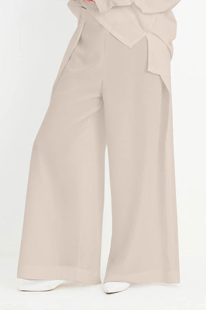 Planet Peachskin Origami Pant in Fawn.  Wide leg pull on pant with 1 1/2" waistband and elastic back.  Folded single pleat at each leg.  30" inseam._35105179893960