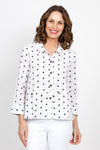 Habitat Dots Shirttail Top in White with embroidered black dots. Pointed collar button down with dropped waist seaming. Hidden front pocket with button. 3/4 sleeve with cuff. 3 button detail at lower back hem. High low hem. Relaxed fit._t_35420225994952
