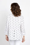 Habitat Dots Shirttail Top in White with embroidered black dots. Pointed collar button down with dropped waist seaming. Hidden front pocket with button. 3/4 sleeve with cuff. 3 button detail at lower back hem. High low hem. Relaxed fit._t_35420225962184