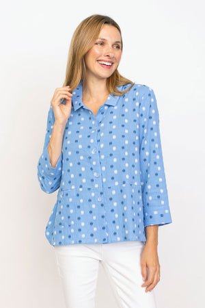 Habitat Dots Shirttail Top in Cornflower with embroidered blue and white dots.  Pointed collar button down with dropped waist seaming.  Hidden front pocket with button.  3/4 sleeve with cuff.  3 button detail at lower back hem.  High low hem.  Relaxed fit._35407371043016