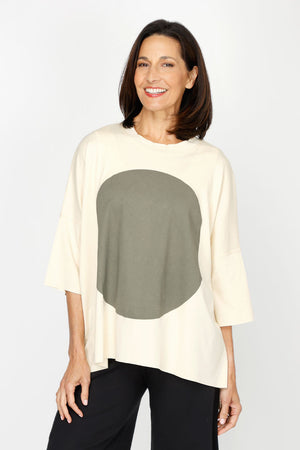Planet ORB T in Butter with a large Green screen print circle in front. Crew neck with drop shoulder and 3/4 length sleeve. High low hem. Oversized fit._60432418373998