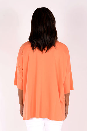 Planet ORB T in Creamsicle with a large Watermelon screen print circle in front. Crew neck with drop shoulder and 3/4 length sleeve. High low hem. Oversized fit._34239543214280