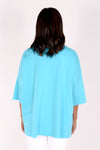 Planet ORB T in Turquoise with a large Royal screen print circle in front. Crew neck with drop shoulder and 3/4 length sleeve. High low hem. Oversized fit._t_34239542853832