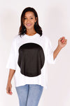 Planet ORB T in White with a large Black screen print circle in front. Crew neck with drop shoulder and 3/4 length sleeve. High low hem. Oversized fit._t_34239542984904
