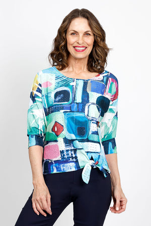 Top Ligne Abstract Geometric Tie Front Top in Multi.  Bright abstract multi colored geometric print.  Crew neck 3/4 sleeve top with off center front tie at hem.  Relaxed fit._35438947958984