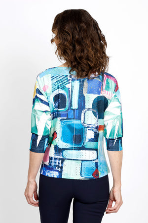 Top Ligne Abstract Geometric Tie Front Top in Multi. Bright abstract multi colored geometric print. Crew neck 3/4 sleeve top with off center front tie at hem. Relaxed fit._35438947991752
