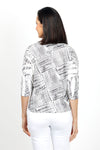 Top Ligne Woven Side Tie Top. Black woven line print on a white background. Crew neck 3/4 sleeve top with an asymmetric front tie. Relaxed fit._t_35032736465096