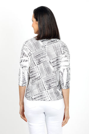 Top Ligne Woven Side Tie Top. Black woven line print on a white background. Crew neck 3/4 sleeve top with an asymmetric front tie. Relaxed fit._35032736465096