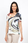 Top Ligne Swirls V neck Top.  Black, beige swirl print with splashes of red and green on a white background.  Lightly stamped and perforated design.  V neck with short sleeves.  Sublimation screen printing allows white streaks to show through.  Relaxed fit._t_35526271500488
