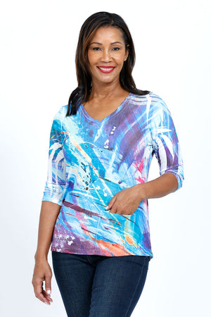The Color Burst Pocket Top  features a relaxed shape  and a hidden front pocket. We love the combination of the easy-to-wear a-line shape and the luxurious poly-jersey fabric with a bit of stretch.  White streaks known as sublimation "smiles" are part of the dying process and create a unique pattern._34735780790472