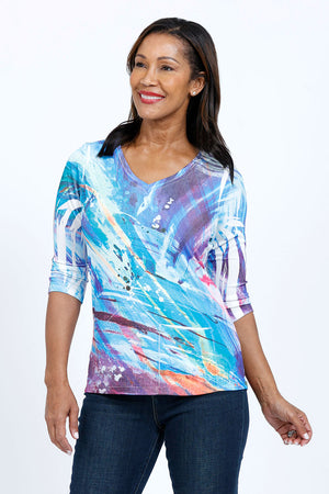 The Color Burst Pocket Top  features a relaxed shape  and a hidden front pocket. We love the combination of the easy-to-wear a-line shape and the luxurious poly-jersey fabric with a bit of stretch.  White streaks known as sublimation "smiles" are part of the dying process and create a unique pattern._34735780823240