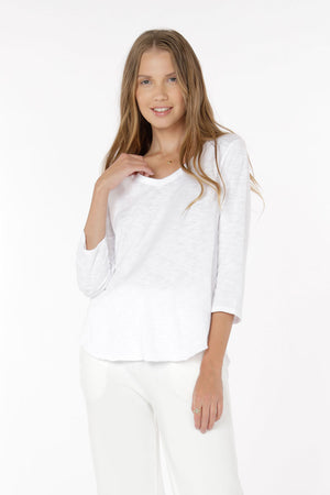 Mododoc 3Q Sleeve V Neck Tee in White. V neck 3/4 sleeve tee with double layer curved hem. Raw edge at hem._34467819782344