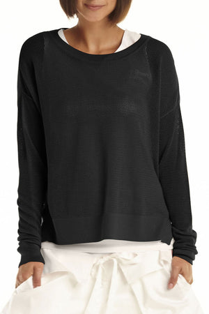 Planet Mini Seed Stitch Sweater in Black.  Fine seed stitch crew neck with long sleeves and dropped shoulders.  Deep side slits.  Rib trim at neck, cuff and around hem.  _61189535203694