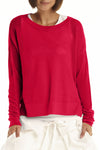Planet Mini Seed Stitch Sweater in Chili.  Fine seed stitch crew neck with long sleeves and dropped shoulders.  Deep side slits.  Rib trim at neck, cuff and around hem.  _t_61189535105390