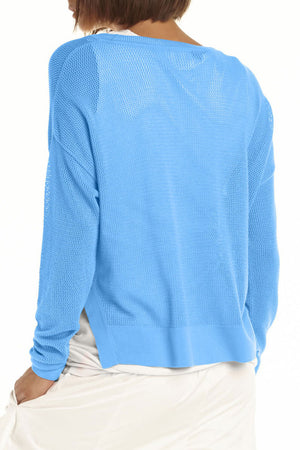 Planet Mini Seed Stitch Sweater in Sapphire.  Fine seed stitch crew neck with long sleeves and dropped shoulders.  Deep side slits.  Rib trim at neck, cuff and around hem.  _61189535236462