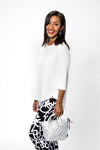 Lolo Luxe High Low Solid Top in White. Crew neck, 3/4 sleeve top with curved seams. High low hem. Relaxed fit._t_34191359246536