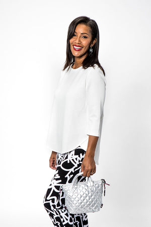 Lolo Luxe High Low Solid Top in White. Crew neck, 3/4 sleeve top with curved seams. High low hem. Relaxed fit._34191359246536
