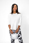Lolo Luxe High Low Solid Top in White. Crew neck, 3/4 sleeve top with curved seams. High low hem. Relaxed fit._t_34191359213768