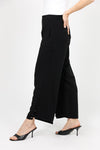 Lemon Grass Crop Pant with Button Detail. Pull on pant with 1 1/2" waistband elasticized in back. Faux front welt pocket detail. Draped leg. Side insets at hem create step hem. 3 button detail at hem. 25" inseam._t_35087786934472