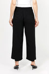 Lemon Grass Crop Pant with Button Detail. Pull on pant with 1 1/2" waistband elasticized in back. Faux front welt pocket detail. Draped leg. Side insets at hem create step hem. 3 button detail at hem. 25" inseam._t_35087786868936