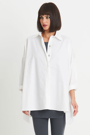Planet EZ Shirt in White.  Pointed collar button down blouse with covered button placket.  Swing shape.  High low hem with side slits.  Long sleeves with roll cuffs.  Oversized fit.  One size fits many._34276446765256