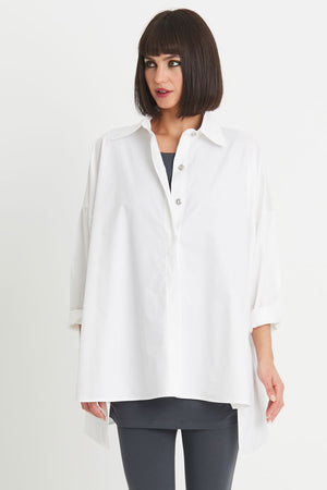 Planet EZ Shirt in White.  Pointed collar button down blouse with covered button placket.  Swing shape.  High low hem with side slits.  Long sleeves with roll cuffs.  Oversized fit.  One size fits many._34276446765256