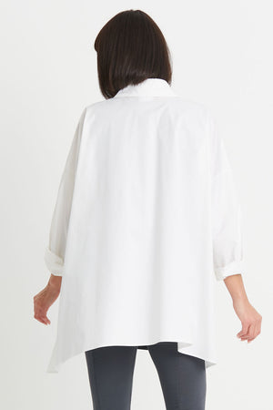 Planet EZ Shirt in White. Pointed collar button down blouse with covered button placket. Swing shape. High low hem with side slits. Long sleeves with roll cuffs. Oversized fit. One size fits many._34276446830792