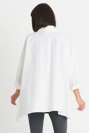 Planet EZ Shirt in White. Pointed collar button down blouse with covered button placket. Swing shape. High low hem with side slits. Long sleeves with roll cuffs. Oversized fit. One size fits many._34276446830792