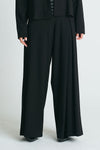 Planet Scuba Single Pleat Pants in Black.  Pull on pant with 1 1/4" waistband elastic in back.  Single inverted pleat on front left leg.  Wide leg.  Inseam: 30"_t_61187572498798