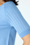 Metric Short Sleeve Pointelle Sweater in Light Denim.  Crew neck, raglan short sleeve knit with pointelle stitching on sleeve. Raised center front seam.  Rib trim at neck, hem and cuff.  Relaxed fit._t_59972752572782