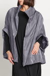 Planet Nylon Chic Cape in Lava. Cocoon shaped double faced nylon jacket with 2 openings for arms. Cross between cape and a poncho._t_61184992706926