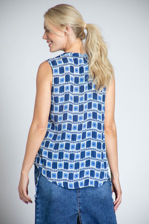 APNY Dot That Sleeveless Blouse in Blue. Block print with dots and stripes in shades of blue and white. Sleeveless banded collar button down blouse. A line shape. Curved hem. Relaxed fit._35227691712712