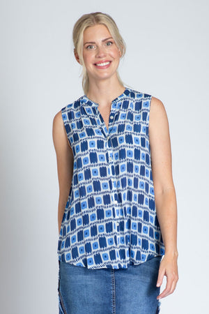APNY Dot That Sleeveless Blouse in Blue.  Block print with dots and stripes in shades of blue and white.  Sleeveless banded collar button down blouse.  A line shape.  Curved hem.  Relaxed fit._35227691778248