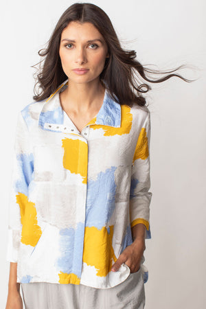 LIV by Habitat Crinkle Snap Shacket in Sane.   Light blue gold sand and white abstract splash print.  Convertible collar snap front hybrid blouse/jacket with hidden snap placket.  3/4 sleeve with split cuff.  2 front welt pockets.  High low hem.  Relaxed fit._35028832944328