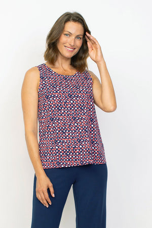 Habitat Travel Knit Easy Dot Tank.  Crew neck sleeveless a line tank.  Blue rimmed white dots on an orange background.  Relaxed fit._35285578973384