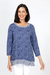 Habitat Travel Knit Pleat Back Tunic in Navy. Navy rimmed white dots on a blue background. Crew neck 3/4 sleeve a line top with complentary blue stick print on a white background. Pleat detail in back. Relaxed fit._t_35322902970568