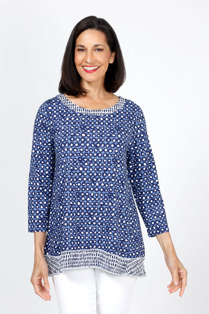 Habitat Travel Knit Pleat Back Tunic in Navy. Navy rimmed white dots on a blue background. Crew neck 3/4 sleeve a line top with complentary blue stick print on a white background. Pleat detail in back. Relaxed fit._35322902970568