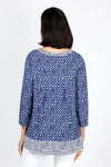 Habitat Travel Knit Pleat Back Tunic in Navy. Navy rimmed white dots on a blue background. Crew neck 3/4 sleeve a line top with complentary blue stick print on a white background. Pleat detail in back. Relaxed fit._t_35322902937800