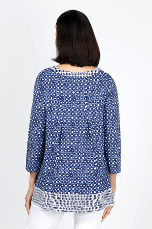 Habitat Travel Knit Pleat Back Tunic in Navy. Navy rimmed white dots on a blue background. Crew neck 3/4 sleeve a line top with complentary blue stick print on a white background. Pleat detail in back. Relaxed fit._35322902937800
