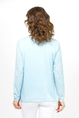Elliott Lauren Double Layer Sweater in light Blue. Tee shirt/knit combo. Crew neck sweater with white trim at neck and armhole seams. Long sleeves and side slits. White cotton tee underlayer. Unlined sleeves. Relaxed fit._35067862384840