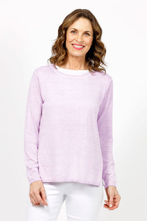 Elliott Lauren Double Layer Sweater in Wisteria, a light purple. Tee shirt/knit combo. Crew neck sweater with white trim at neck and armhole seams. Long sleeves and side slits. White cotton tee underlayer. Unlined sleeves. Relaxed fit._35067861795016