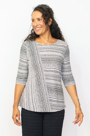 Habitat Waves Mixed Direction Top in Black. Textural waved stripes in a non wrinkle fabric. Front asymmetric diagonal seam stripe with horizontal stripe panel. Horizontal striped back. Crew neck, 3/4 sleeve. Relaxed fit._35353297420488