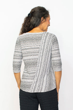Habitat Waves Mixed Direction Top in Black. Textural waved stripes in a non wrinkle fabric. Front asymmetric diagonal seam stripe with horizontal stripe panel. Horizontal striped back. Crew neck, 3/4 sleeve. Relaxed fit._35353297453256