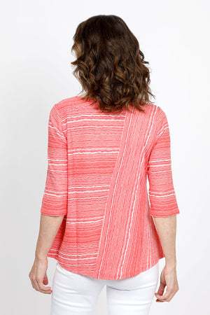 Habitat Waves Mixed Direction Top in Melon. Textural waved stripes in a non wrinkle fabric. Front asymmetric diagonal seam stripe with horizontal stripe panel. Horizontal striped back. Crew neck, 3/4 sleeve. Relaxed fit._35420237758664