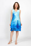 Top Ligne Watercolor Speckles Dress in Blue.  Speckled watercolor print in shades of blue.  Sleeveless v neck dress with 2 attached layers.  Bottom layer has attached ruffle at hem.  Top shorter layer.  Relaxed fit._t_35408815718600
