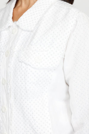 Top Ligne Linen Jacket with Stones in White.  Jean jacket styling with white studded panels in front, back and sleeve.  Bracelet sleet with studded button cuff.  Banded hem, contour seaming, front button flap pockets.  Raw edges.  Relaxed fit._60221027484014