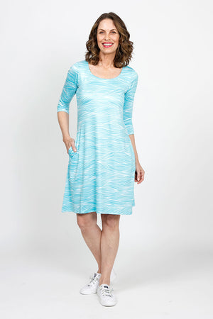 Top Ligne Soft Waves Pocket Dress in Aqua.  Aqua and white wave print.  Scoop neck 3/4 sleeve dress.  Side seam pockets.  A line shape.  Relaxed fit._35408803496136