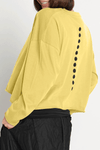 Planet Dot Mini Boxy T in Chartreuse with black miniature dot pattern down front and back. Crew neck long sleeve tee with raw edges. Boxy fit._t_59597860012398