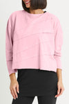 Planet Mini Tucked T in Bubble Gum pink. Crew neck cropped oversized tee with diagonal tuck pleats on front and back. Long sleeves. Oversized fit._t_35312319922376