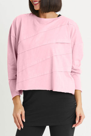 Planet Mini Tucked T in Bubble Gum pink. Crew neck cropped oversized tee with diagonal tuck pleats on front and back. Long sleeves. Oversized fit._35312319922376